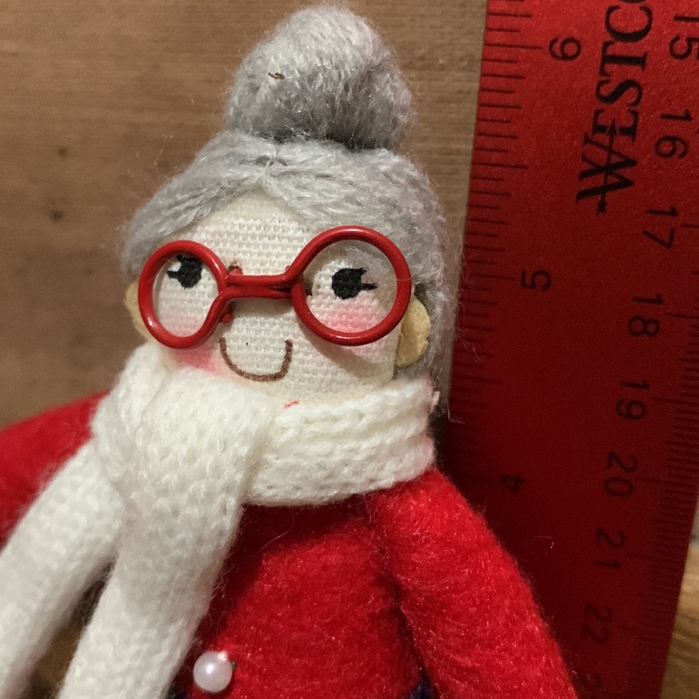 Adorable Mrs. Claus snowshoeing felt ornament.